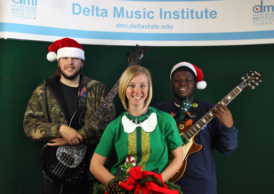 Grammy U members participating in the Toys for Tots Drive include, left to right, Scott Stogner of Saltillo, Joanna Sabine of Columbia, and Horace Willis of Arcola.